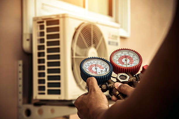 Professional Heat Pump Repair technician working in Warren, AR